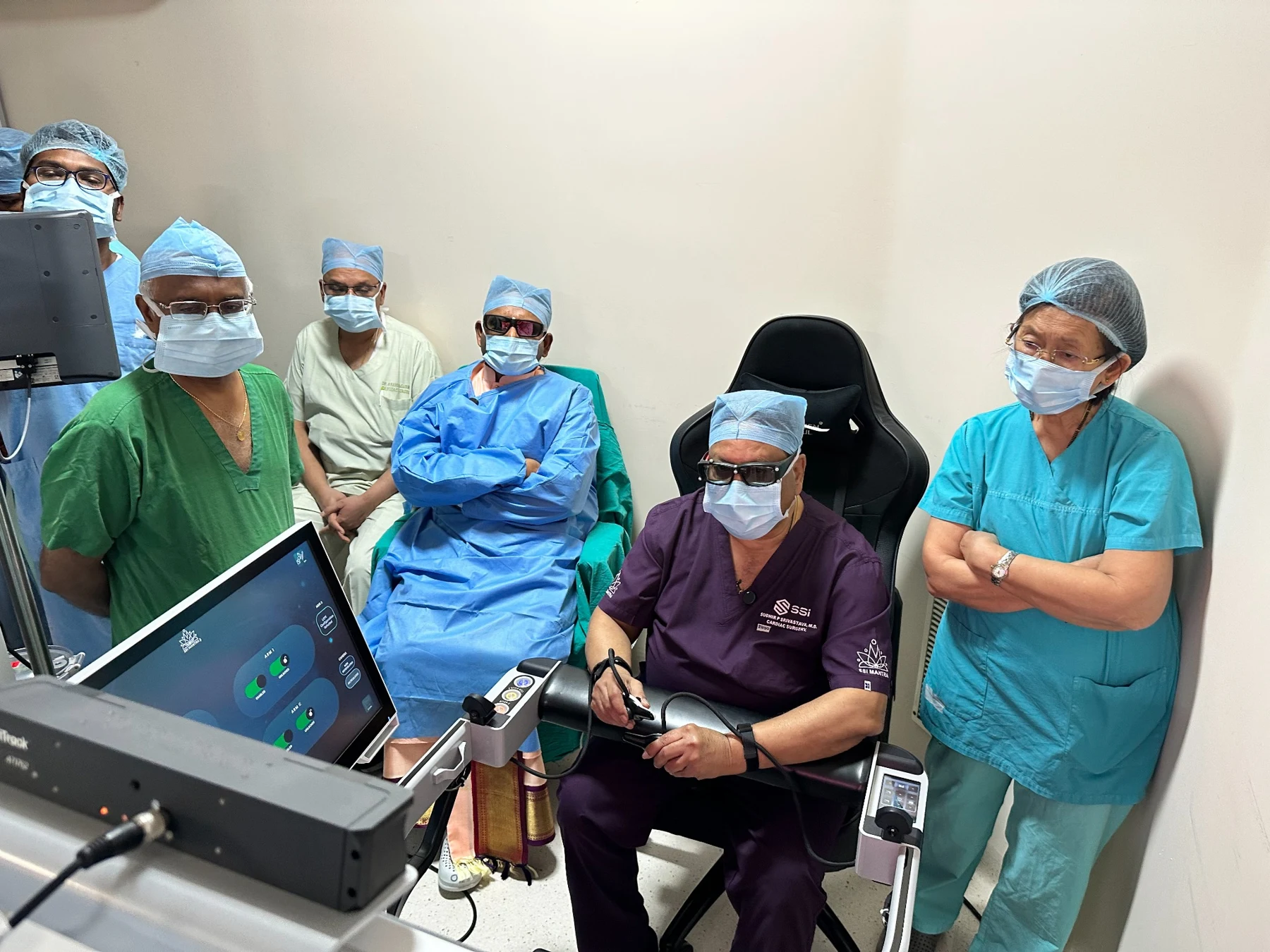 Dr. Srivastava at a surgical console with an operating-room team