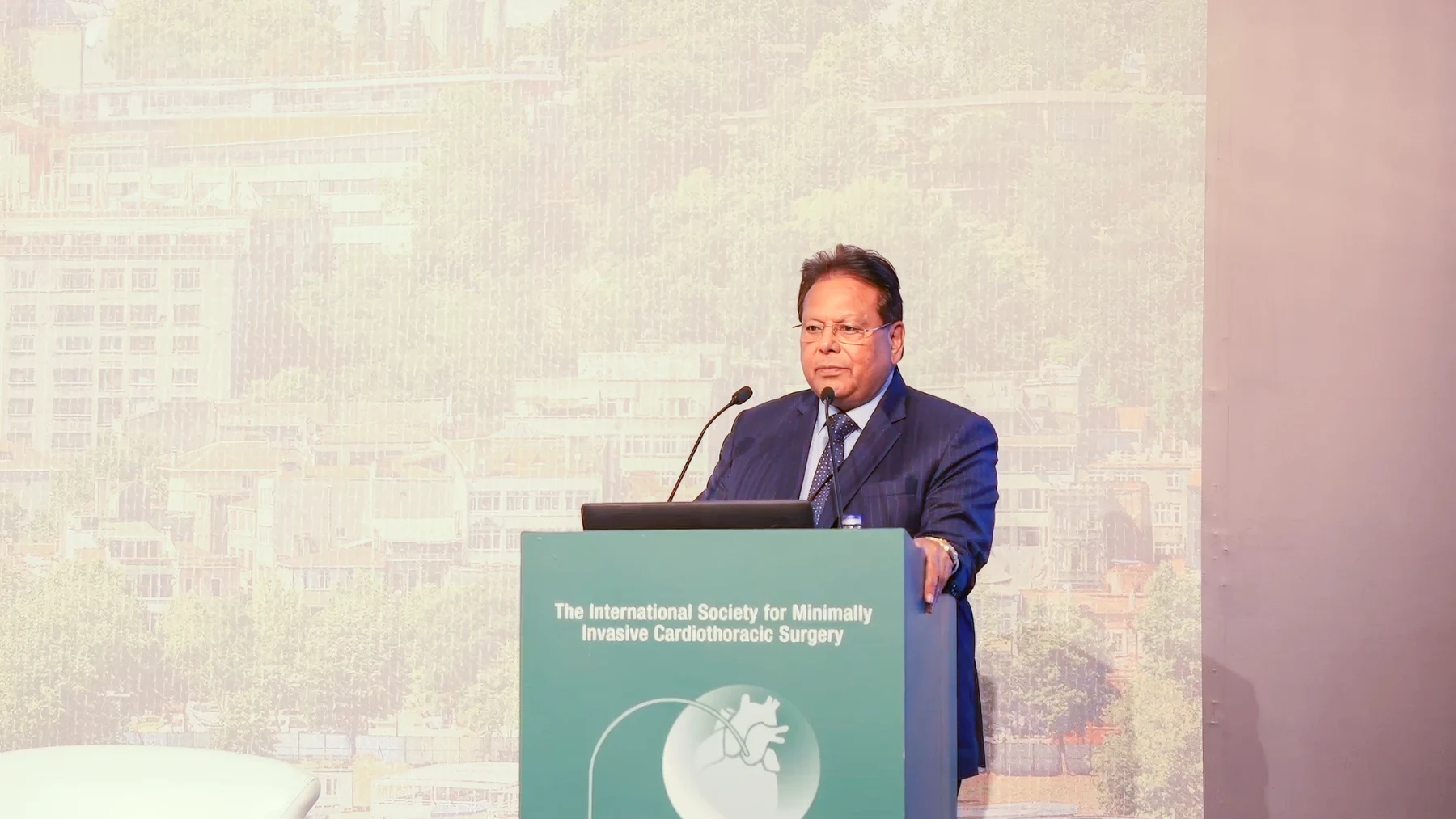 Dr. Srivastava speaking at a lectern