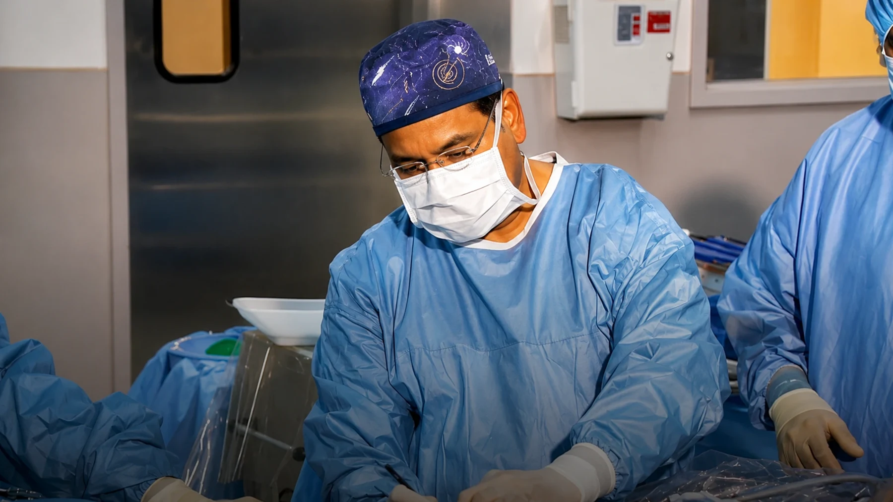 Dr. Srivastava at work in surgical attire